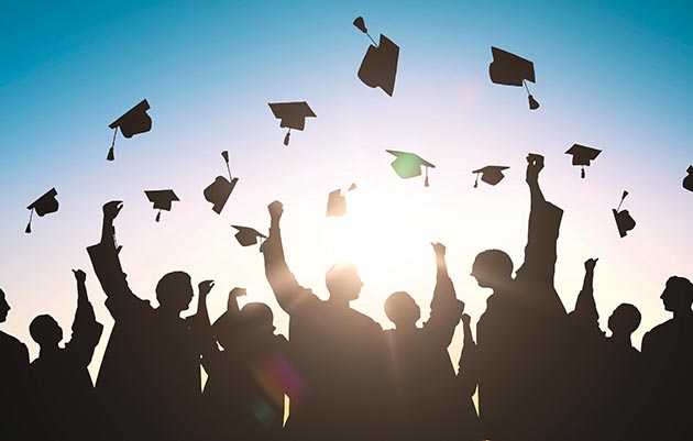 graduation hats in the air